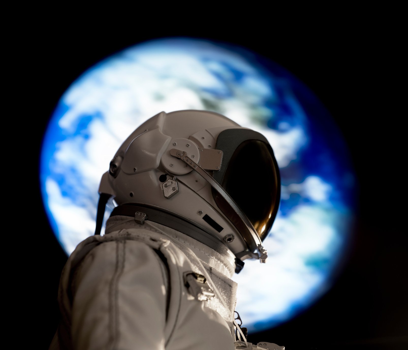 earth behind astronaut